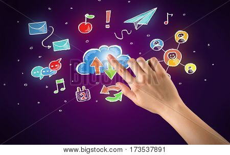 Female hand toucing mixed media icons with purple background