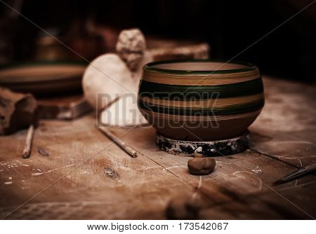 closeup handmade clay object in wooden table