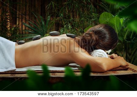 portrait of young beautiful woman in spa environment