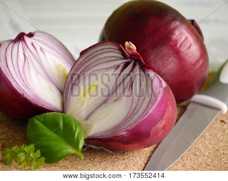 red onion whole and the cut, leaf of basil and parsley