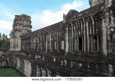 In Area around Angkor Wat part of Khmer temple complex popular among tourists ancient landmark and place of worship in Southeast Asia. Siem Reap Cambodia.