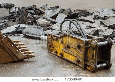 Broken asphalt on the street made for digging trenches for laying of communications in the city