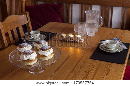 Swedish home baked, homemade semla, not for sale. A temptation in February with cream, marzipan and icing sugar.