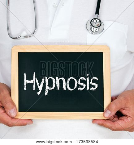 Hypnosis - Doctor holding chalkboard with text