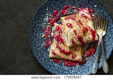 Pancakes With Custard And Cherry Strawberry Coulis And Nuts