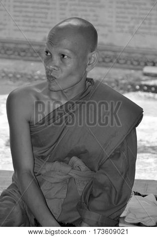 PHNOM KULEN CAMBODIA MARCH 27: Monk in Wat Preah Ang Thom on march 27 2013 in Phnom Kulen Camodia. Buddhism is the faith of 96% of Cambodians.