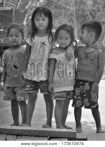 PHNOM PHEN, CAMBODIA MARCH 23: Unidentified street children posing on march 23 2013 in Phnom Phen,Cambodia.In Phnom Penh alone there are between 10,000 and 20,000 children live and work on the streets