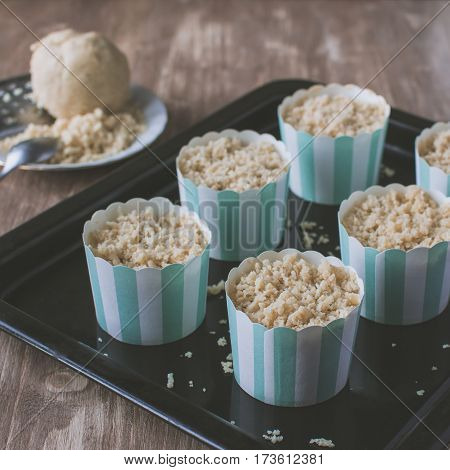 Making Muffins, Adding Streusel To The Pastry