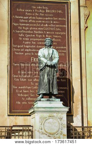 STOCKHOLM SWEDEN - AUGUST 19 2016: Statue of the writer Olaus Petri in Storkyrkan on Gamla stan statue by the Swedish sculptor Theodor Lundberg in 1898. in Stockholm Sweden on August 19 2016.