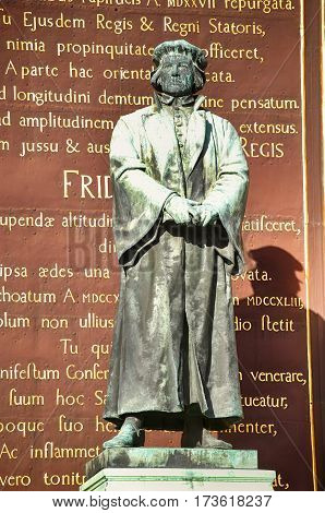 STOCKHOLM SWEDEN - AUGUST 19 2016: Statue of the writer Olaus Petri in Storkyrkan on Gamla stan statue by the Swedish sculptor Theodor Lundberg in 1898. in Stockholm Sweden on August 19 2016.