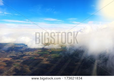 clouds seen from an airplane sun sunshine