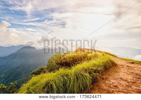 Beautiful landscape nature of high mountain colourful sunlight cloud and sky on Phi Pan Nam Range during sunset in winter from viewpoint Phu Chi Fa Forest Park at Chiang Rai Province Thailand
