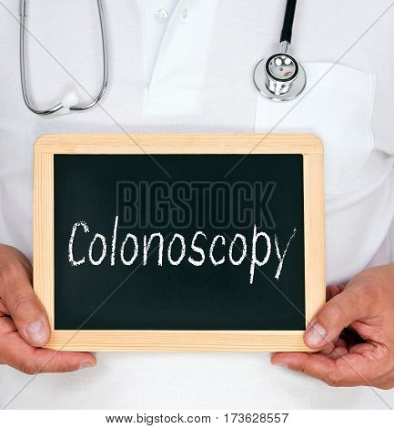 Colonoscopy, Doctor Holding Chalkboard With Text In His Hands