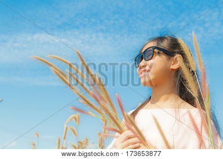 Girl And Feather Pennisetum
