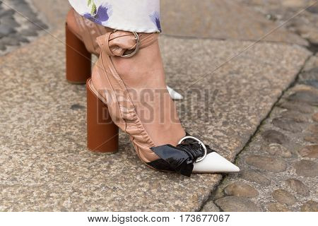 MILAN ITALY - FEBRUARY 23: Detail of shoes outside Genny fashion show during Milan Women's Fashion Week on FEBRUARY 23 2017 in Milan.