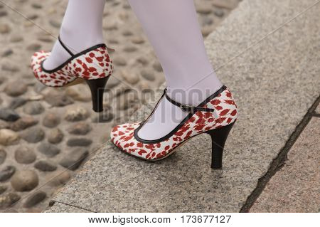 MILAN ITALY - FEBRUARY 23: Detail of shoes outside Genny fashion show during Milan Women's Fashion Week on FEBRUARY 23 2017 in Milan.