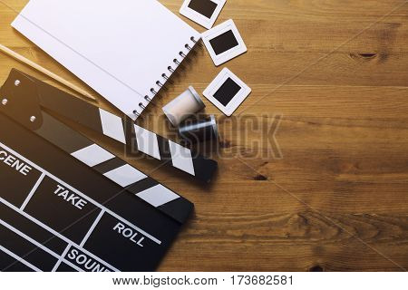 movie clapper on wood table top view
