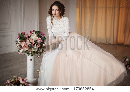 Young bride in a luxurious wedding dress