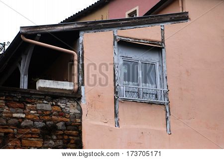 Windows with white wooden frames.The old house and the street in the historic center in Lyon, France