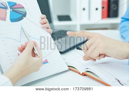 Close-up of hands on business meeting.  Fresh view, review situation, look at new angle, professional training, white collar, investment and finance concept.