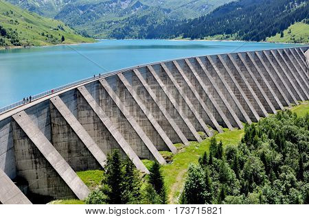 dam and artificial lake in mountain landscape