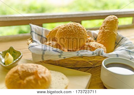 Breakfast with bread cheese sausage baloney sausage and coffee