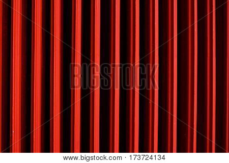 Graphic background red heater. Geometric abstract photo. Intensely red backdrop