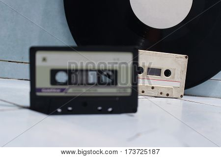 Audio cassettes and vinyl records. Retro style.