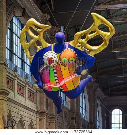 Zurich, Switzerland - 9 October, 2016: the famous Nana figure in the hall of the Zurich main railway station. The figure was created by a French sculptor, painter and filmmaker Niki de Saint Phalle (1930 - 2002).