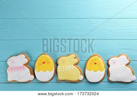 Creative Easter sugar cookies on turquoise wooden background