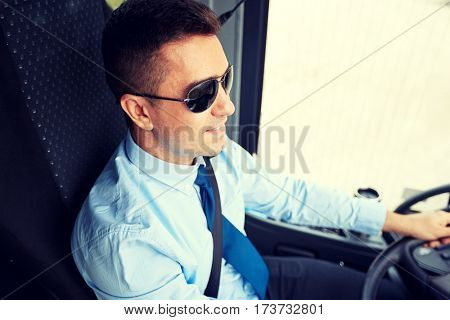 transport, tourism, road trip and people concept - happy driver driving intercity bus