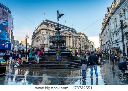 London UK - February 27 2017: Crowds of people and tourists visiting picadilly circus on after a stormy afternoon