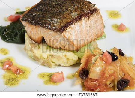 grilled fresh samon fillet with vegetables on white