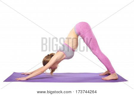 Attractive young sporty girl practicing yoga postures. White background.