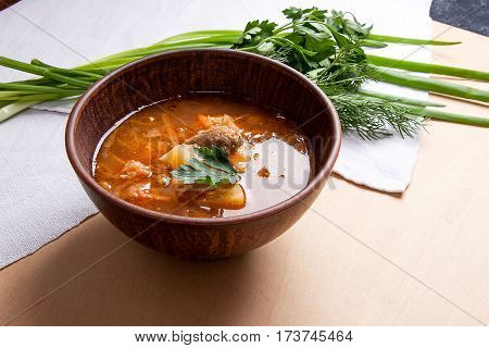 Borsch - Traditional Ukrainian And Russian Red Beetroot Soup With Red Beets In Clay Bowl On Wooden B