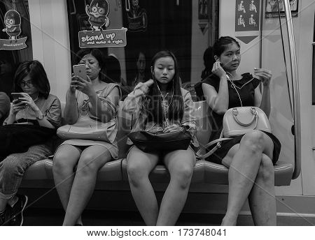 Passengers In The Mrt Train In Singapore