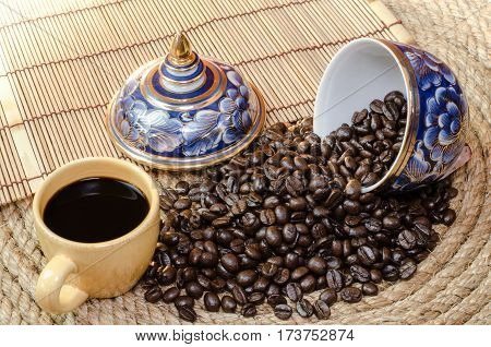 Cup of coffee with Benjarong on a jute rope.