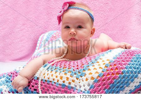 A cute newborn baby girl sleeping. Sweet little baby portrait. Use the photo to represent life parenting or childhood