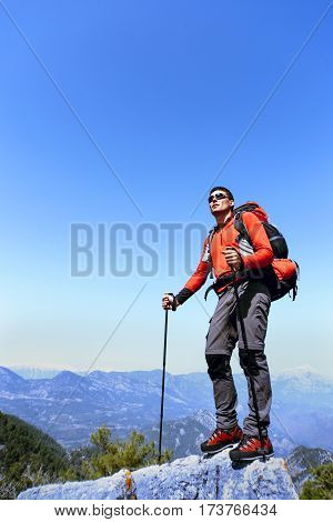 Summer hiking in the mountains with a backpack.