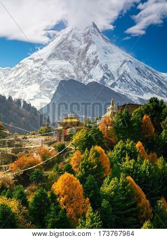 Buddhist monastery and Manaslu mount in Himalayas, Nepal.  View from Manaslu circuit trek