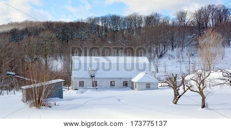 BROMONT QUEBEC CANADA 02 02 2017: Winter landscape old farm in country side of Bromont it is in the Brome-Missisquoi Regional County Municipality