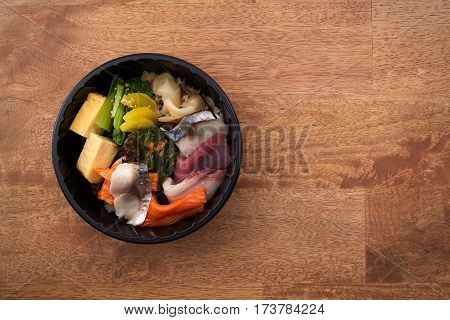 Japanese Food Tekka Don Take Away On Wooden Background
