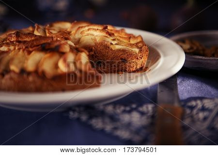 yummy apple pie on a blue tablecloth