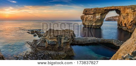 Gozo Malta - Panoramic view of the beautiful Azure Window a natural arch and famous landmark on the island of Gozo at sunset