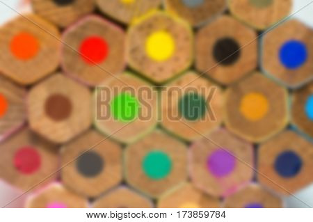 close up of blurred colored pencils on isolated white background