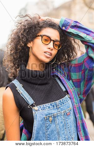 MILAN ITALY - FEBRUARY 23: Beautiful model poses outside Fendi fashion show during Milan Women's Fashion Week on FEBRUARY 23 2017 in Milan.