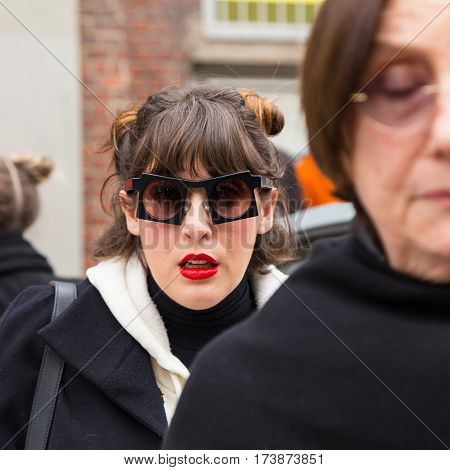 MILAN ITALY - FEBRUARY 23: Fashionable woman poses outside Fendi fashion show during Milan Women's Fashion Week on FEBRUARY 23 2017 in Milan.