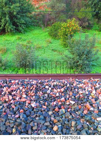 Closeup of railway ballast on sunny day in Spain