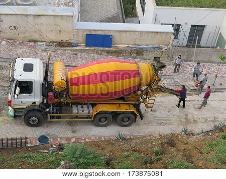 Alora Spain - Febuary 21 2017: Lorry delivering ready mixed concrete for resurfacing road
