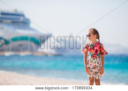 Adorable little girl at tropical beach on vacation